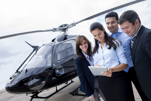Business people traveling by helicopter